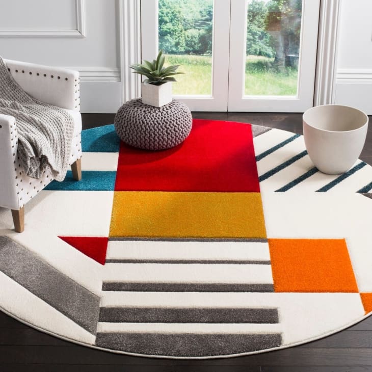 This New Rug Trend is the Easiest Way to Make Your Living Room More
